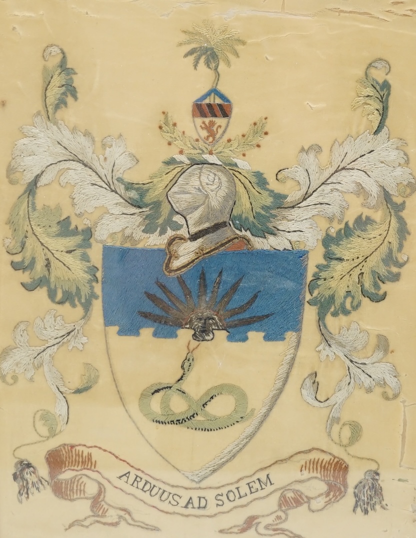A 19th century silk embroidered coat of arms for Manchester University, 30.5cm high, 23cm wide. Condition - the main body of silk is damaged but embroidery colours good